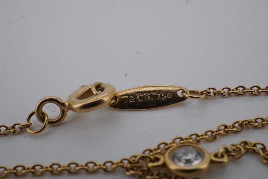 Elsa Peretti for Tiffany and Co., an 18ct gold and diamond 'Diamonds by the Yard' necklace and and bracelet, circa 2016, each composed of a spectacle-set brilliant-cut diamond weighing approximately 0.10 carats, to a fin